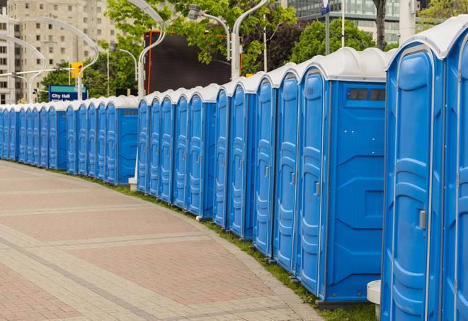 a row of portable restrooms at a fairground, offering visitors a clean and hassle-free experience in hightstown